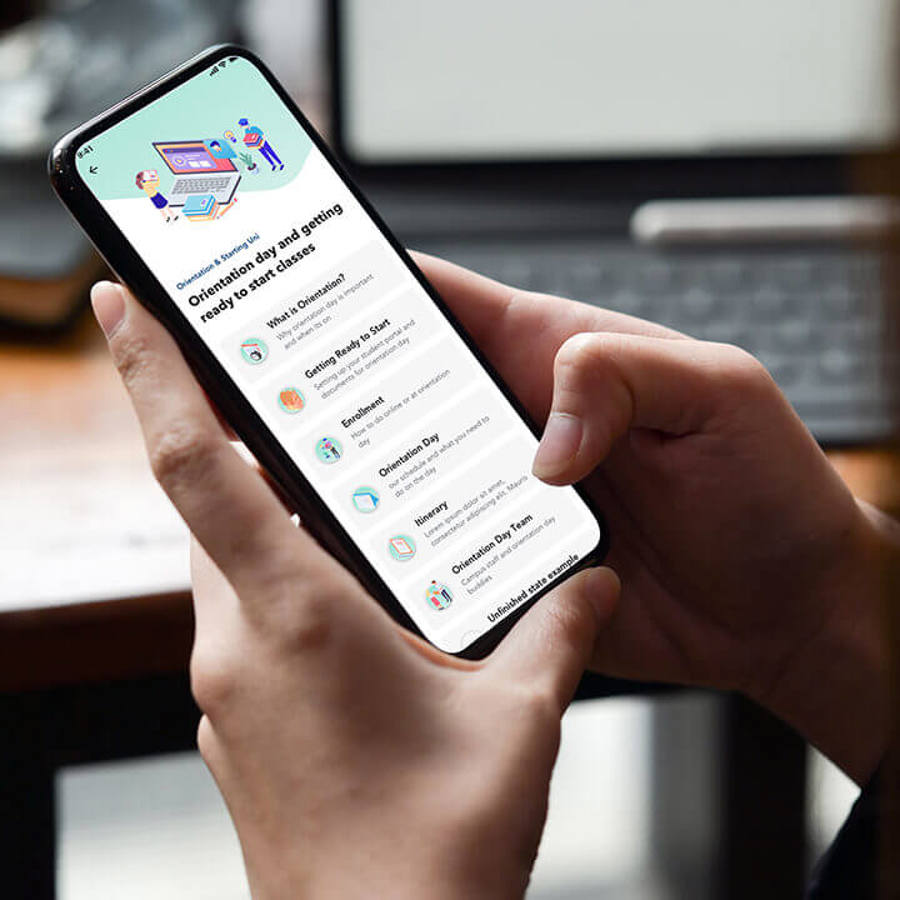 Hands holding mobile phone using Orientation Go app 