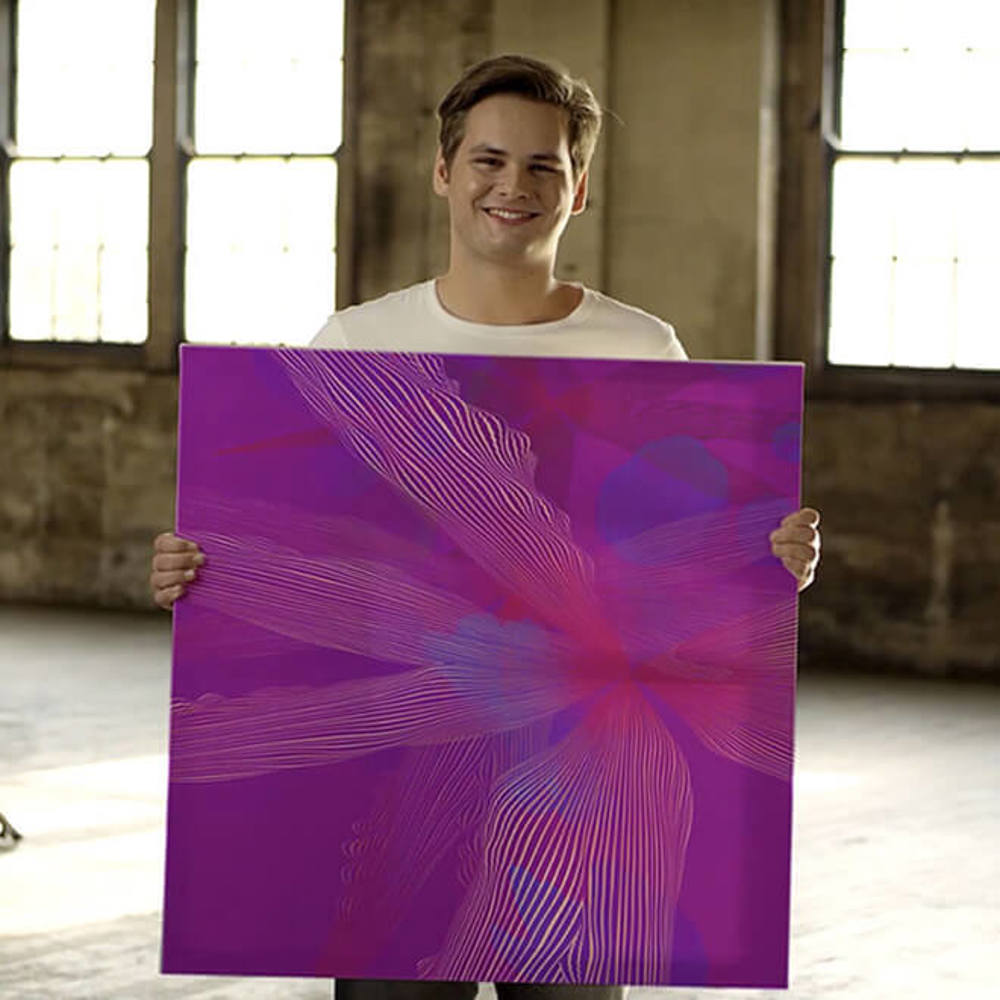 Young man holding artwork