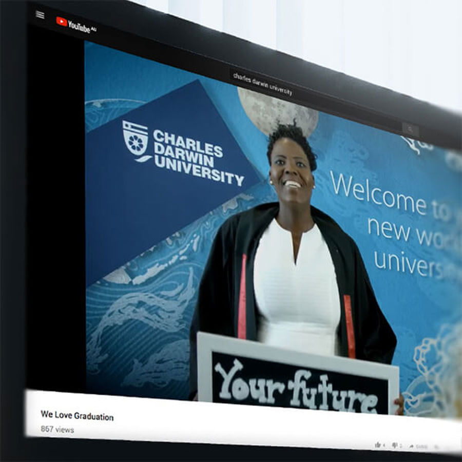 Screenshot from Charles Darwin University UTube showing student at podium