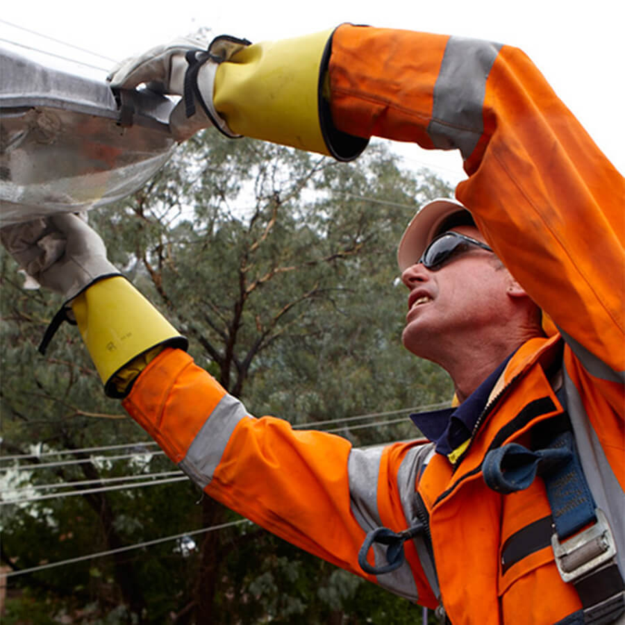 Essential Energy worker repairing streetlight