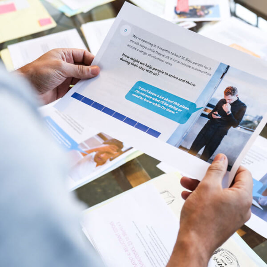 Hands holding printed Navitas problem statement
