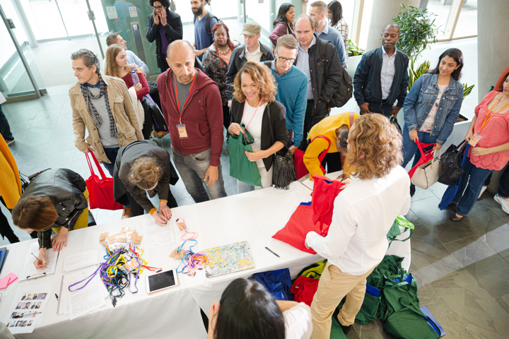 People signing up for conference
