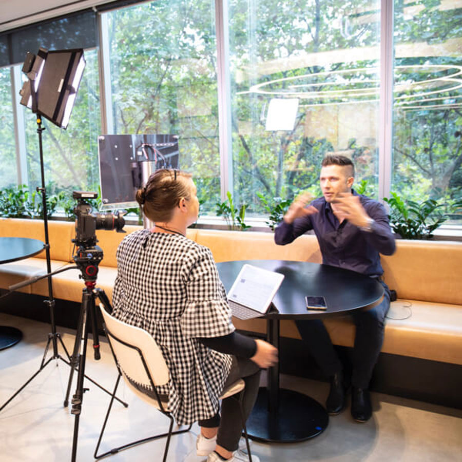 Image of two people in office engage in customer immersion session