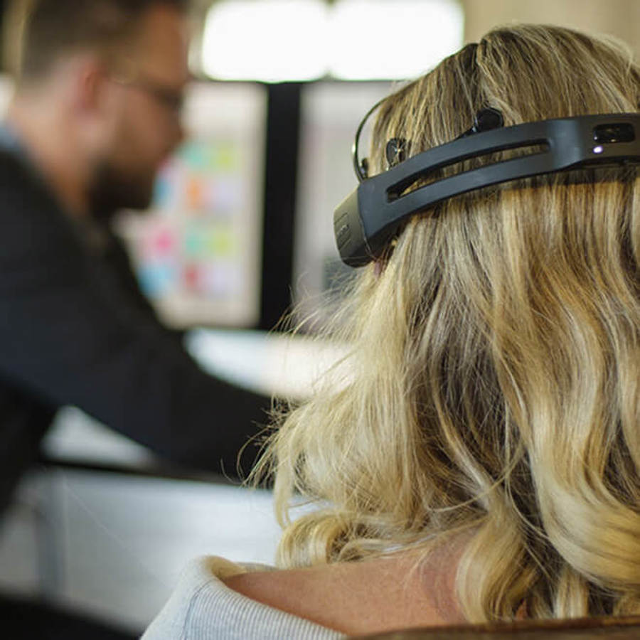 Lady wearing EEG headset technology