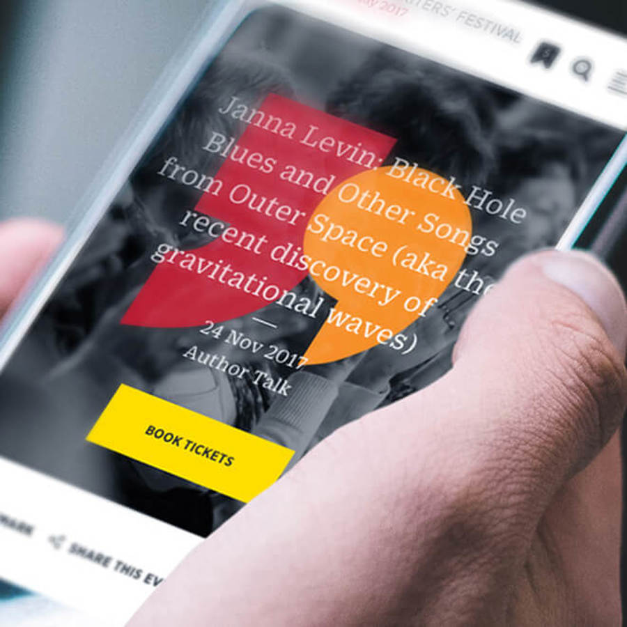 Hand holding mobile phone displaying Sydney Writers Festival