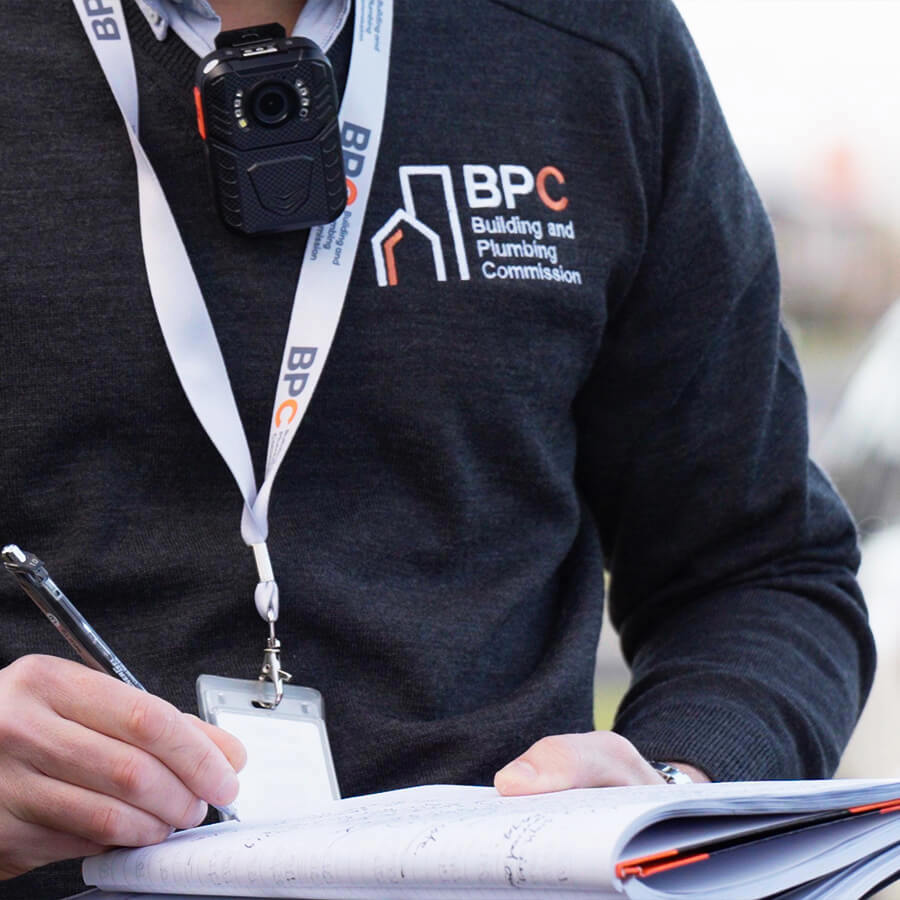 A BPC building inspector carrying out an audit on-site.