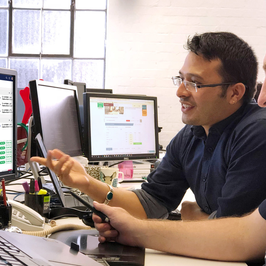 Image of two developers working on TEEG content in Umbraco