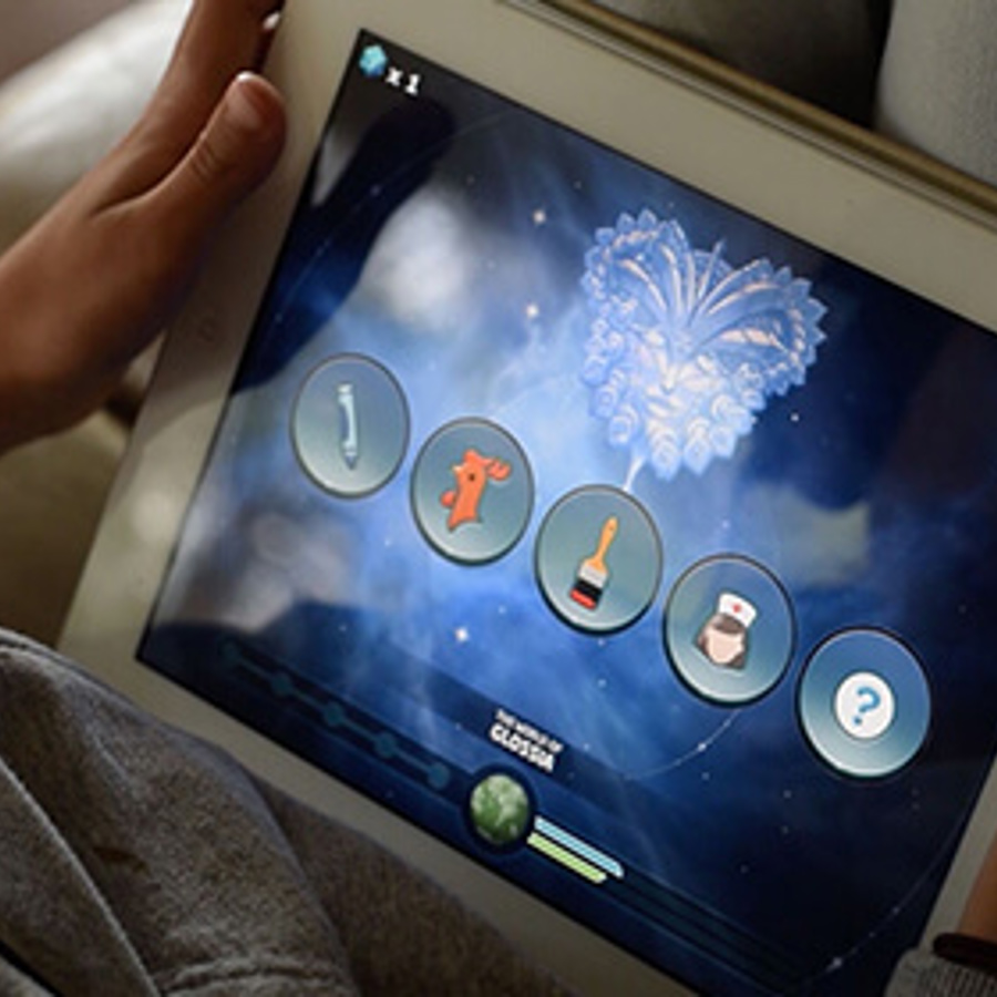 Child playing remediation app Sound Storm on iPad